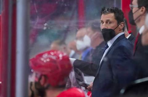 Apr 12, 2021; Raleigh, North Carolina, USA; Carolina Hurricanes head coach Rod BrindÕAmour looks on from the bench against the Detroit Red Wings at PNC Arena. Mandatory Credit: James Guillory-USA TODAY Sports