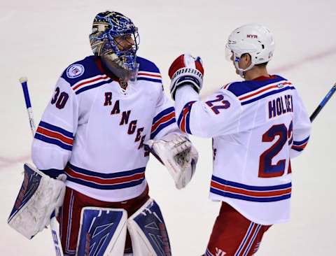 Nov 15, 2016; Vancouver, British Columbia, CAN; New York Rangers goaltender Antti Raanta (22) congratulates goaltender Henrik Lundqvist (30) for the win during the third period at Rogers Arena. The New York Rangers won 7-2. Mandatory Credit: Anne-Marie Sorvin-USA TODAY Sports