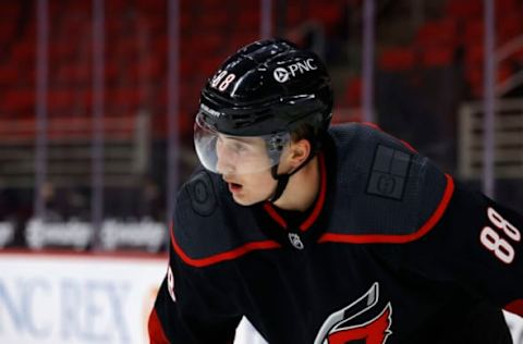 RALEIGH, NORTH CAROLINA – JANUARY 28: Martin Necas #88 of the Carolina Hurricanes looks on during the first period of their game against the Tampa Bay Lightning at PNC Arena on January 28, 2021, in Raleigh, North Carolina. (Photo by Jared C. Tilton/Getty Images)