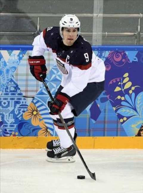 Feb 13, 2014; Sochi, RUSSIA; USA forward Zach Parise (9) skates with the puck against Slovakia in a men’s ice hockey preliminary round game during the Sochi 2014 Olympic Winter Games at Shayba Arena. Mandatory Credit: Richard Mackson-USA TODAY Sports