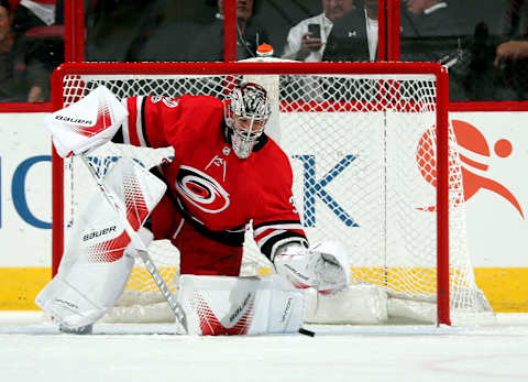 RALEIGH, NC – OCTOBER 27: Cam Ward #30 of the Carolina Hurricanes lunges to cover a loose puck during an NHL game against the St. Louis Blues on October 27, 2017 at PNC Arena in Raleigh, North Carolina. (Photo by Gregg Forwerck/NHLI via Getty Images)