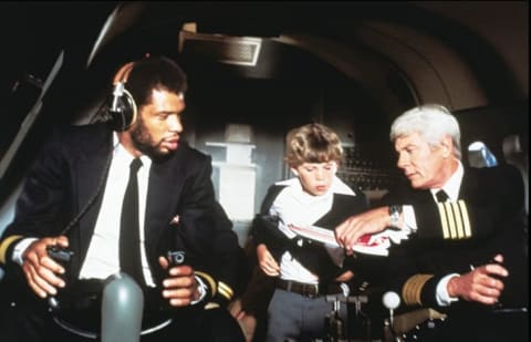 Kareem Abdul-Jabbar, Rossie Harris, and Peter Graves in Airplane! (1980).