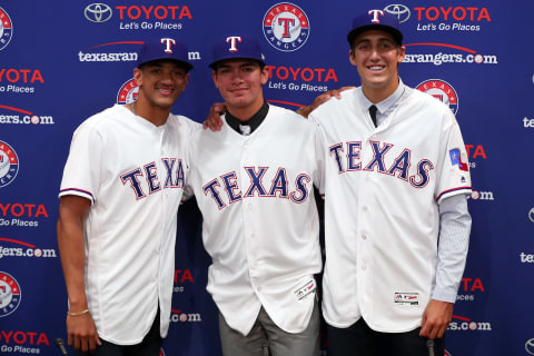 ARLINGTON, TX – JUNE 16: (L-R) Bubba Thommpson from McGill-Toolen High School, Chris Seeise out of West Orange High School and right-handed pitcher Haans Crouse out of Dana Hills High School pose for a photo after the Texas Rangers announced the signings of several of the club’s top selections in the 2017 Major League Baseball Draft at Globe Life Park in Arlington on June 16, 2017 in Arlington, Texas. (Photo by Tom Pennington/Getty Images)