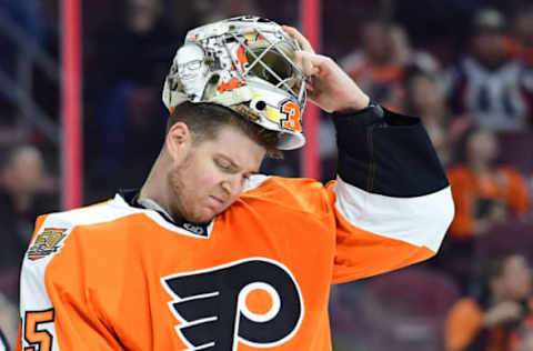 Feb 28, 2017; Philadelphia, PA, USA; Philadelphia Flyers goalie Steve Mason (35) adjusts his mask during a break against the Colorado Avalanche during the third period at Wells Fargo Center. The Flyers defeated the Avalanche 4-0. Mandatory Credit: Eric Hartline-USA TODAY Sports