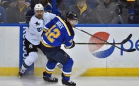 May 15, 2016; St. Louis, MO, USA; San Jose Sharks right wing Joonas Donskoi (27) and St. Louis Blues center David Backes (42) battle for position during the third period in game one of the Western Conference Final of the 2016 Stanley Cup Playoffs at Scottrade Center. The St. Louis Blues defeat the San Jose Sharks 2-1. Mandatory Credit: Jasen Vinlove-USA TODAY Sports