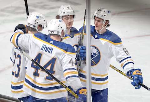 NEWARK, NEW JERSEY – FEBRUARY 20: Matt Irwin #44 of the Buffalo Sabres is congratulated by teammates Sam Reinhart #23,Jack Eichel #9 and Victor Olofsson #68 of the Buffalo Sabres after Irwin scored in the second period against the New Jersey Devils at Prudential Center on February 20, 2021 in Newark, New Jersey. (Photo by Elsa/Getty Images)