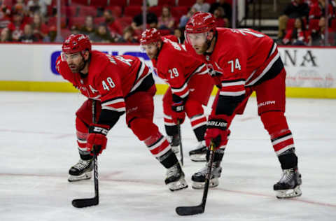 RALEIGH, NC – SEPTEMBER 27: Carolina Hurricanes left wing Jordan Martinook (48), Carolina Hurricanes defenseman Jaccob Slavin (74) and Carolina Hurricanes center Brian Gibbons (29) line up for a face-off during an NHL Pre-Season game between the Carolina Hurricanes and the Nashville Predators on September 27, 2019 at the PNC Arena in Raleigh, NC. (Photo by John McCreary/Icon Sportswire via Getty Images)