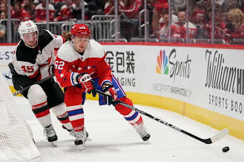 WASHINGTON, DC – JANUARY 11: Carl Hagelin #62 of the Washington Capitals skates with the puck against Sami Vatanen #45 of the New Jersey Devils in the third period at Capital One Arena on January 11, 2020 in Washington, DC. (Photo by Patrick McDermott/NHLI via Getty Images)