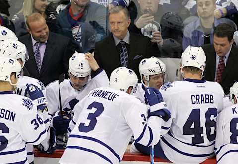 WINNIPEG, CANADA – DECEMBER 31: Toronto Maple Leafs’ head coach Ron Wilson watches from the bench. (Photo by Marianne Helm/Getty Images)