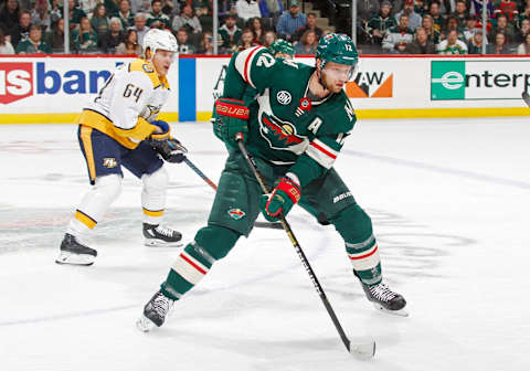 ST. PAUL, MN – MARCH 25: Eric Staal #12 of the Minnesota Wild and Mikael Granlund #64 of the Nashville Predators follow the play during a game at Xcel Energy Center on March 25, 2019 in St. Paul, Minnesota. (Photo by Bruce Kluckhohn/NHLI via Getty Images)