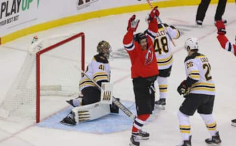 Jan 16, 2021; Newark, New Jersey, USA; New Jersey Devils left wing Miles Wood (44) celebrates his goal on Boston Bruins goaltender Jaroslav Halak (41) during the first period at Prudential Center. Mandatory Credit: Ed Mulholland-USA TODAY Sports