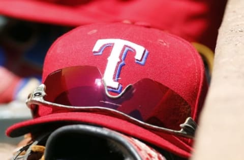 Aug 2, 2015; Arlington, TX, USA; A general view of a Texas Rangers hat and glasses in the dugout during the game against the San Francisco Giants at Globe Life Park in Arlington. Texas won 2-1. Mandatory Credit: Tim Heitman-USA TODAY Sports