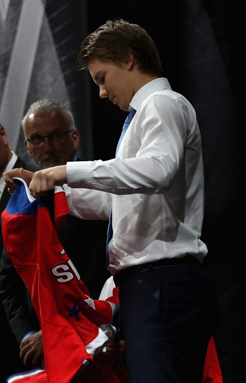 SUNRISE, FL – JUNE 26: Ilya Samsonov puts on a jersey after being selected 22nd by the Washington Capitals during Round One of the 2015 NHL Draft at BB&T Center on June 26, 2015 in Sunrise, Florida. (Photo by Dave Sandford/NHLI via Getty Images)