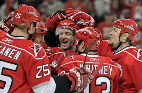 Carolina Hurricanes’ Justin Williams (11) was congratulated by teammates Rod Brind’Amour (17), Joni Pitkanen (25), Ray Whitney (13) and Joe Corvo (77) after he scored during first period action against the Florida Panthers at the RBC Center in Raleigh, North Carolina, on Thursday December 18, 2008. (Photo by Chris Seward/Raleigh News & Observer/MCT via Getty Images)