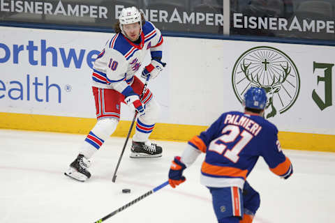 New York Rangers left wing Artemi Panarin (10) controls the puck against New York Islanders ry Credit: Brad Penner-USA TODAY Sports