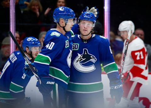 Elias Pettersson & Brock Boeser of the Vancouver Canucks celebrate. (Photo by Jeff Vinnick/NHLI via Getty Images)