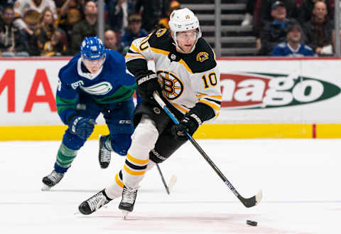 VANCOUVER, BC – FEBRUARY 22: Anders Bjor #10 of the Boston Bruins skates with the puck during NHL action against the Vancouver Canucks at Rogers Arena on February 22, 2020 in Vancouver, Canada. (Photo by Rich Lam/Getty Images)