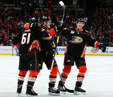 ANAHEIM, CA – FEBRUARY 27: Troy Terry #61, Josh Manson #42 and Hampus Lindholm #47 of the Anaheim Ducks celebrate Terry’s third-period goal against the Chicago Blackhawks during the game at Honda Center on February 27, 2019, in Anaheim, California. (Photo by Debora Robinson/NHLI via Getty Images)