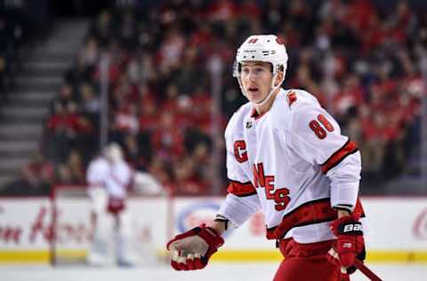 CALGARY, AB – DECEMBER 14: Carolina Hurricanes Right Wing Martin Necas (88) disputes a penalty call during the first period of an NHL game where the Calgary Flames hosted the Carolina Hurricanes on December 14, 2019, at the Scotiabank Saddledome in Calgary, AB. (Photo by Brett Holmes/Icon Sportswire via Getty Images)