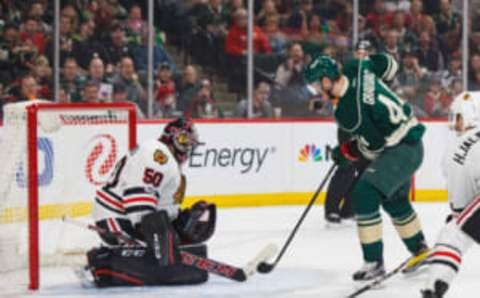 Feb 21, 2017; Saint Paul, MN, USA; Chicago Blackhawks goalie Corey Crawford (50) makes a save in the first period against the Minnesota Wild forward Tyler Graovac (44) at Xcel Energy Center. Mandatory Credit: Brad Rempel-USA TODAY Sports