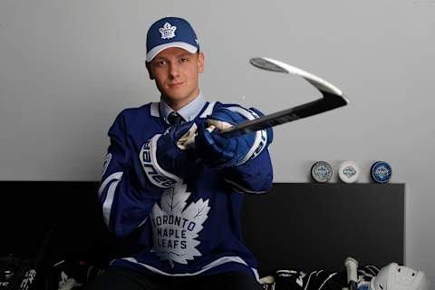 VANCOUVER, BRITISH COLUMBIA – JUNE 22: Mikko Kokkonen reacts after being selected 84th overall by the Toronto Maple Leafs   (Photo by Kevin Light/Getty Images)