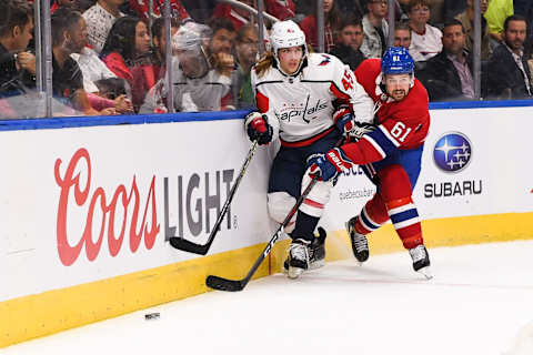 QUEBEC CITY, QC – SEPTEMBER 20: Montreal Canadiens defenceman Xavier Ouellet (61) and Washington Capitals left wing Axel Jonsson-Fjallby (45) fight for the puck during the Washington Capitals versus the Montreal Canadiens preseason game on September 20, 2018, at Centre Videotron in Quebec City, QC (Photo by David Kirouac/Icon Sportswire via Getty Images)