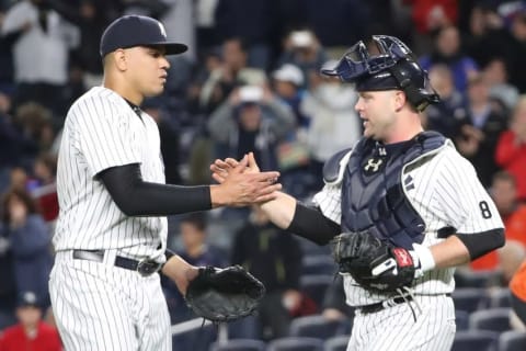 Oct 1, 2016; Bronx, NY, USA; New York Yankees relief pitcher Dellin Betances (68) and catcher Brian McCann (34) celebrate the win against the Baltimore Orioles at Yankee Stadium. New York Yankees won 7-3. Mandatory Credit: Anthony Gruppuso-USA TODAY Sports