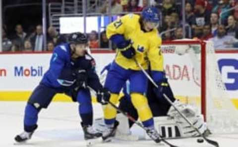 Sep 14, 2016; Washington, DC, USA; Team Sweden forward Loui Eriksson (21) deflects a shot on Team Europe goalie Jaroslav Halak (41) as Team Europe defenseman Mark Streit (7) defends in the second period during a World Cup of Hockey pre-tournament game at Verizon Center. Mandatory Credit: Geoff Burke-USA TODAY Sports