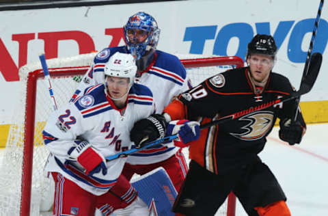 ANAHEIM, CA – MARCH 26: Corey Perry #10 of the Anaheim Ducks battles for position against Nick Holden #22, and Henrik Lundqvist #30 of the New York Rangers during the game at Honda Center in Anaheim, California. (Photo by Debora Robinson/NHLI via Getty Images)