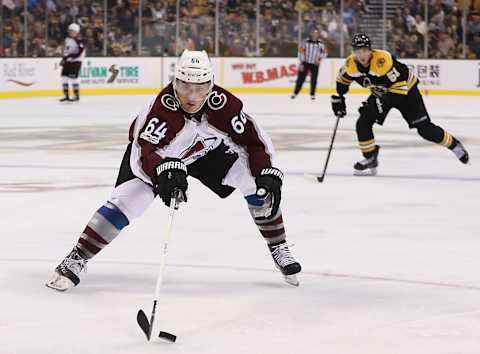 BOSTON – OCTOBER 9: Colorado Avalanche right wing Nail Yakupov (64) slows the puck on his breakaway score with Boston Bruins center Ryan Spooner (51) looking on during the third period. The Boston Bruins host the Colorado Avalanche in a regular season NHL hockey game at TD Garden in Boston on Oct. 9, 2017. (Photo by Matthew J. Lee/The Boston Globe via Getty Images)