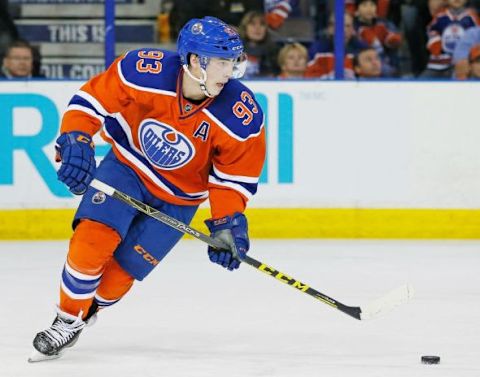 Jan 16, 2016; Edmonton, Alberta, CAN; Edmonton Oilers forward Ryan Nugent-Hopkins (93) carries the puck against the Calgary Flames at Rexall Place. Mandatory Credit: Perry Nelson-USA TODAY Sports