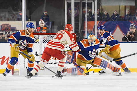 EDMONTON, CANADA – OCTOBER 29: A.J. Greer #18 of the Calgary Flames scores on Stuart Skinner #74 of the Edmonton Oilers during the second period of the 2023 Tim Hortons NHL Heritage Classic at Commonwealth Stadium on October 29, 2023 in Edmonton, Alberta, Canada. (Photo by Derek Leung/Getty Images)