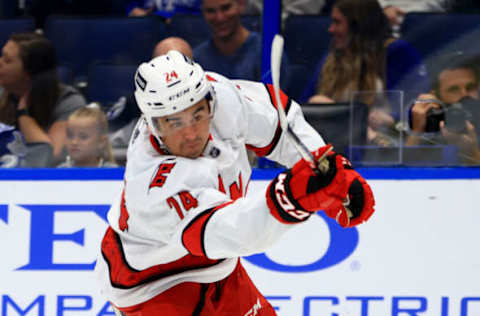 TAMPA, FLORIDA – OCTOBER 01: Seth Jarvis #24 of the Carolina Hurricanes shoots during a preseason game against the Tampa Bay Lightning at Amalie Arena on October 01, 2021, in Tampa, Florida. (Photo by Mike Ehrmann/Getty Images)