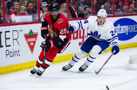 OTTAWA, ON – SEPTEMBER 18: Ottawa Senators defenseman Johnny Oduya (29) backhands a pass from behind the net with Toronto Maple Leafs right wing Kasperi Kapanen (24) giving chase during third period National Hockey League preseason action between the Toronto Maple Leafs and Ottawa Senators on September 18, 2017, at Canadian Tire Centre in Ottawa, ON, Canada. (Photo by Richard A. Whittaker/Icon Sportswire via Getty Images)