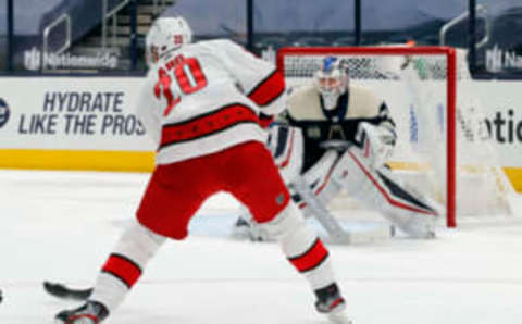 Feb 7, 2021; Columbus, Ohio, USA; Carolina Hurricanes right wing Sebastian Aho (20) takes a shot on goal against the Columbus Blue Jackets during the second period at Nationwide Arena. Mandatory Credit: Russell LaBounty-USA TODAY Sports