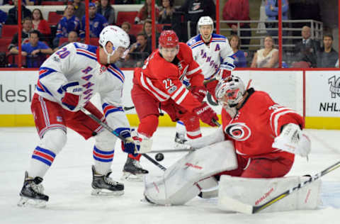 RALEIGH, NC – MARCH 09: Chris Kreider slips the puck past Cam Ward #30 of the Carolina Hurricanes. (Photo by Grant Halverson/Getty Images)