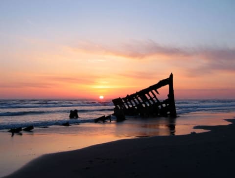 The wreck of the Peter Iredale in the Fort Stevens State Park, Oregon, USA, at sunset