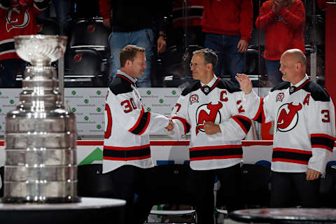 Former New Jersey Devils players (L-R) Martin Brodeur, Scott Niedermayer and Ken Daneyko (Photo by Adam Hunger/Getty Images)