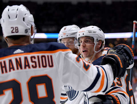 ANAHEIM, CALIFORNIA – FEBRUARY 25: Tyler Ennis #63 of the Edmonton Oilers celebrates his goal with Adam Larsson #6 and Andreas Athanasiou #28, to trail 2-1 to the Anaheim Ducks, during the second period at Honda Center on February 25, 2020 in Anaheim, California. (Photo by Harry How/Getty Images)