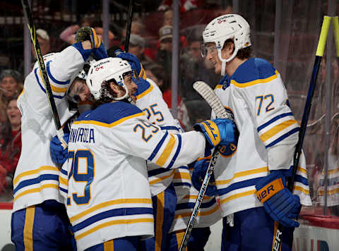 NEWARK, NEW JERSEY – APRIL 21: Owen Power #25 of the Buffalo Sabres is congratulated on his first NHL goal by teammates Vinnie Hinostroza #29, Tage Thompson #72 and Victor Olofsson #71 during the third period against the New Jersey Devils at Prudential Center on April 21, 2022 in Newark, New Jersey. The Buffalo Sabres defeated the New Jersey Devils 5-2. (Photo by Elsa/Getty Images)