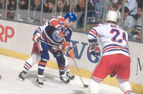 NEW YORK – CIRCA 1985: Mark Messier #11, of the Edmonton Oilers, skates against the New York Rangers during an NHL Hockey game circa 1985 at Madison Square Garden in the Manhattan borough of New York City. Messier’s playing career went from 1978-2004. (Photo by Focus on Sport/Getty Images)