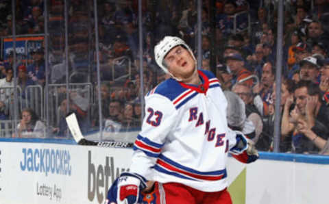 ELMONT, NEW YORK – OCTOBER 26: Adam Fox #23 of the New York Rangers reacts after taking a second-period penalty for tripping Anthony Beauvillier #18 of the New York Islanders at the UBS Arena on October 26, 2022, in Elmont, New York. (Photo by Bruce Bennett/Getty Images)