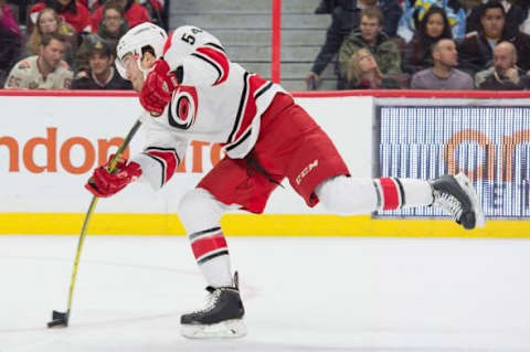 Feb 18, 2016; Ottawa, Ontario, CAN; Carolina Hurricanes defenseman Brett Pesce (54) shoots the puck in the first period against the Ottawa Senators at the Canadian Tire Centre. Mandatory Credit: Marc DesRosiers-USA TODAY Sports