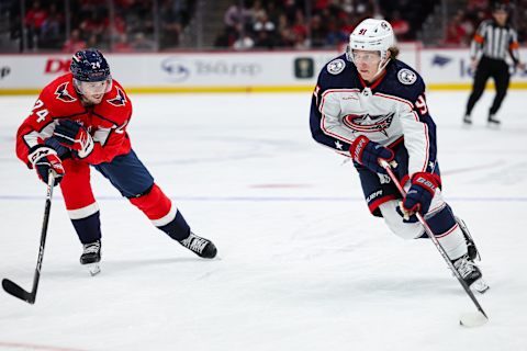 WASHINGTON, DC – OCTOBER 07: Kent Johnson #91 of the Columbus Blue Jackets skates with the puck against Connor McMichael #24 of the Washington Capitals during the first period of the NHL preseason game at Capital One Arena on October 7, 2023 in Washington, DC. (Photo by Scott Taetsch/Getty Images)