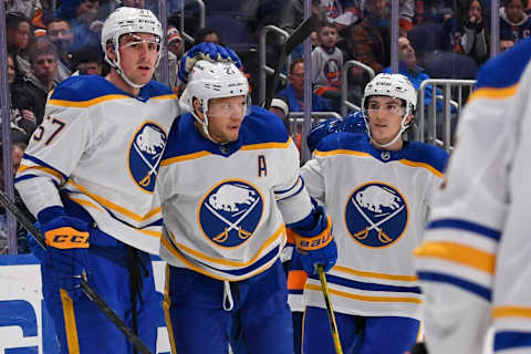 Dec 30, 2021; Elmont, New York, USA; Buffalo Sabres left wing Brett Murray (57) celebrates the goal by Buffalo Sabres right wing Kyle Okposo (21) against the New York Islanders during the first period at UBS Arena. Mandatory Credit: Dennis Schneidler-USA TODAY Sports