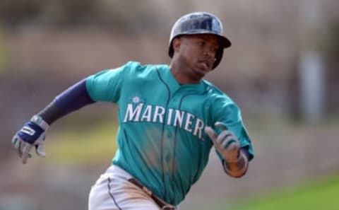 Feb 28, 2017; Phoenix, AZ, USA; Seattle Mariners shortstop Jean Segura (2) rounds third base and scores a run against the Chicago White Sox during the first inning at Camelback Ranch. Mandatory Credit: Joe Camporeale-USA TODAY Sports