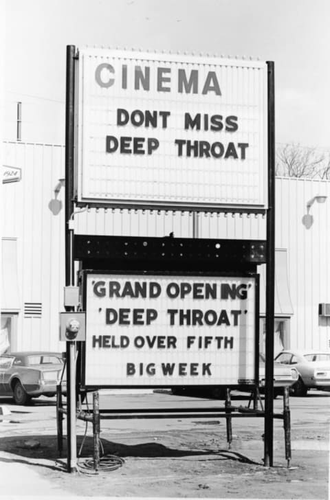 A theater marquee advertises the film Deep Throat, starring Linda Lovelace, in 1972.