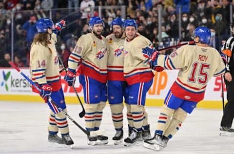 LAVAL, QC – APRIL 08: Cedric Paquette #13 of the Laval Rocket celebrates his goal with teammates Sami Niku #14, Xavier Ouellet #43, Brandon Gignac #37 and Kevin Roy #15 during the second period against the Rochester Americans at Place Bell on April 8, 2022 in Laval, Canada. (Photo by Minas Panagiotakis/Getty Images)