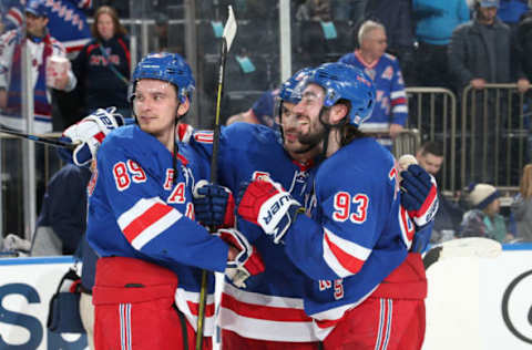 NEW YORK, NY – MARCH 29: Chris Kreider #20, Mika Zibanejad #93 and Pavel Buchnevich #89 of the New York Rangers celebrate after defeating the St. Louis Blues at Madison Square Garden on March 29, 2019 in New York City. (Photo by Jared Silber/NHLI via Getty Images)