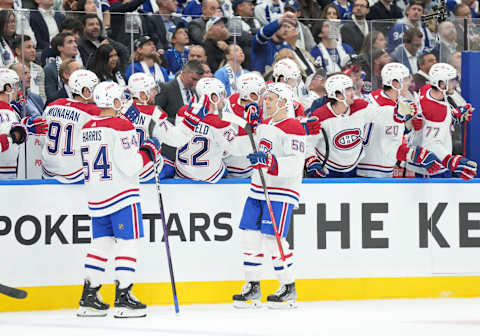 Oct 11, 2023; Toronto, Ontario, CAN; Montreal Canadiens right wing Jesse Ylonen (56) celebrates at the bench after scoring a goal against the Toronto Maple Leafs during the third period at Scotiabank Arena. Mandatory Credit: Nick Turchiaro-USA TODAY Sports